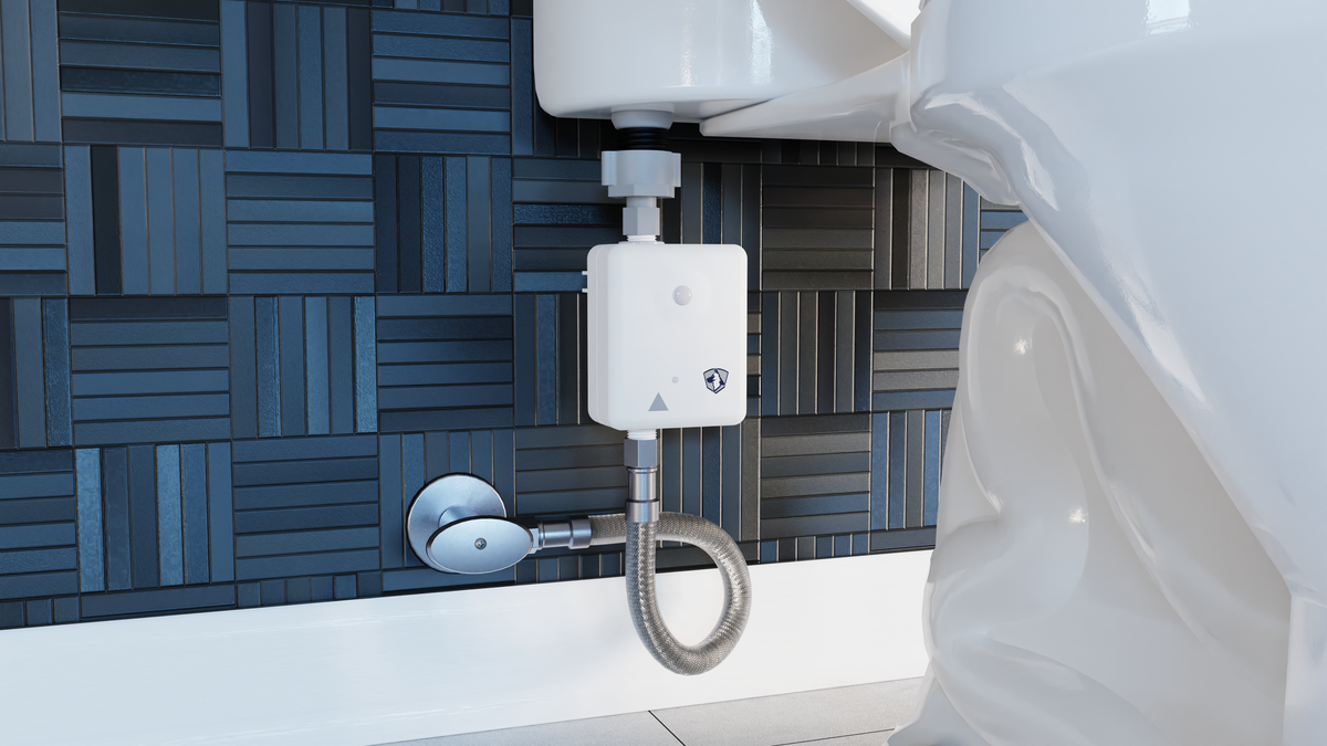 Guard Dog motion-activated toilet shutoff valve installed at a toilet supply line